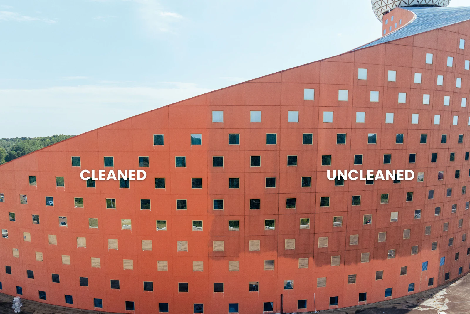 Building exterior with the cleaned half next to the uncleaned half